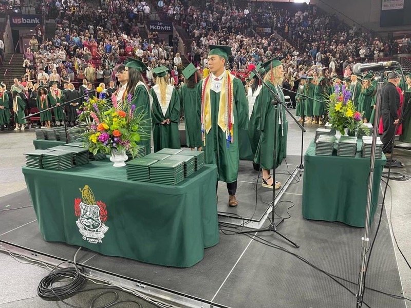 Students stand at Smoky Hill High School's graduation ceremony. Smoky Hill High School sits in the east Centennial area.